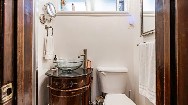 a bathroom with a stove and a window