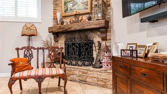 a view of a chairs and table in the back yard of the house