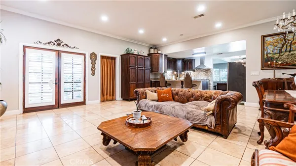 a living room with furniture and large window