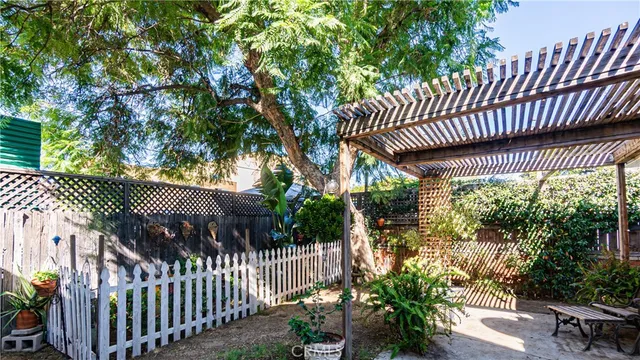 a view of a house with a flower garden