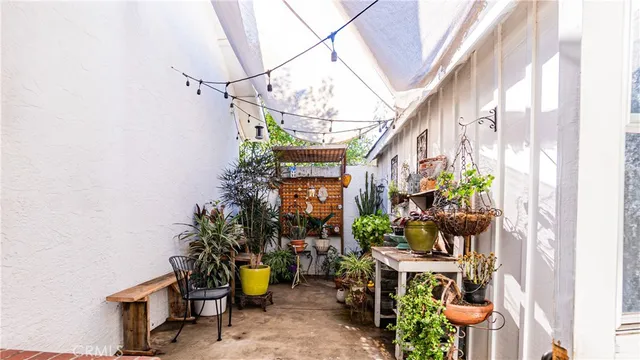 a view of a chairs and table in a patio