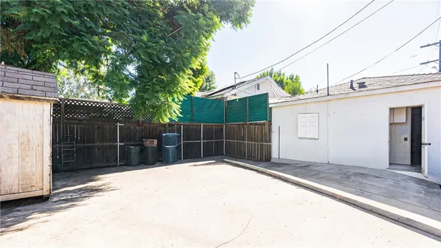an aerial view of a house with garden space and street view