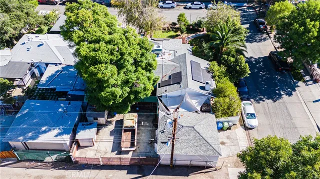 an aerial view of a house with a yard and garden