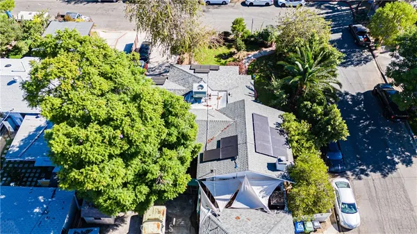 an aerial view of a house with a yard and garden