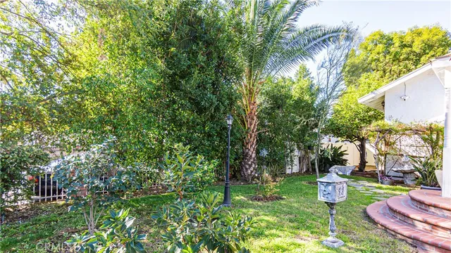 a view of a backyard with sitting area