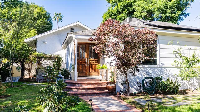 a front view of a house with garden