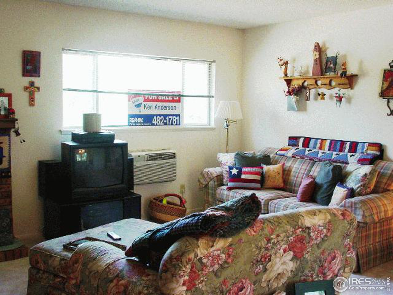 1024 East Swallow Road, Unit 134 Fort Collins, CO 80525 - Photo 4 of 7 a bedroom with a bed and wooden floor