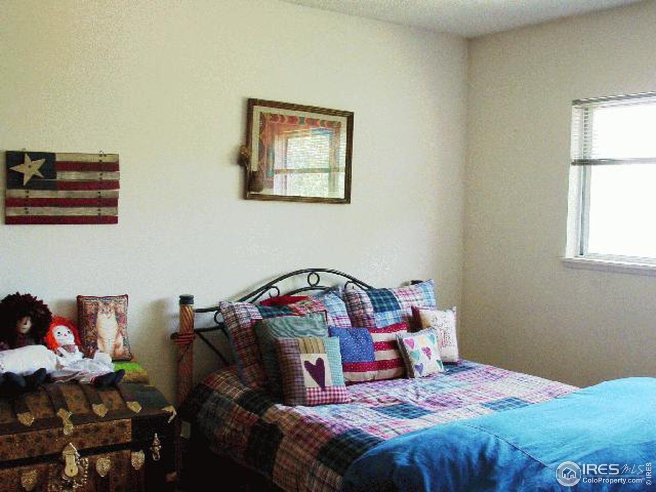 1024 East Swallow Road, Unit 134 Fort Collins, CO 80525 - Photo 6 of 7 a bedroom with a bed and a window