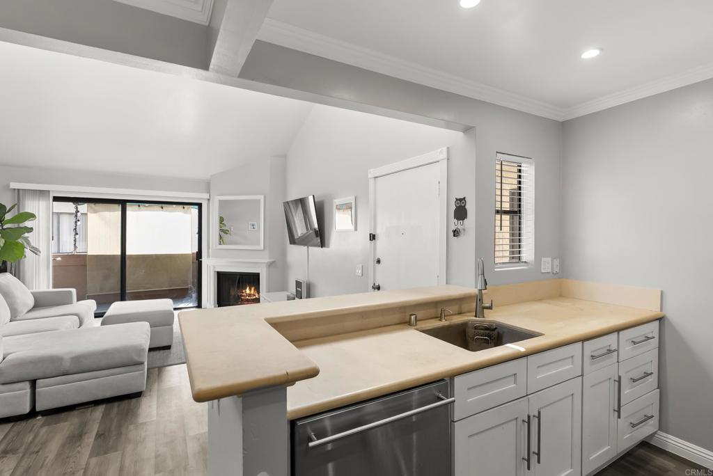 2920 Briarwood Road, Unit G11 Bonita, CA 91902 - Photo 11 of 23 a living room with furniture and a large window