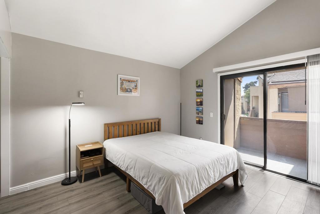 2920 Briarwood Road, Unit G11 Bonita, CA 91902 - Photo 13 of 23 a bedroom with a bed and wooden floor