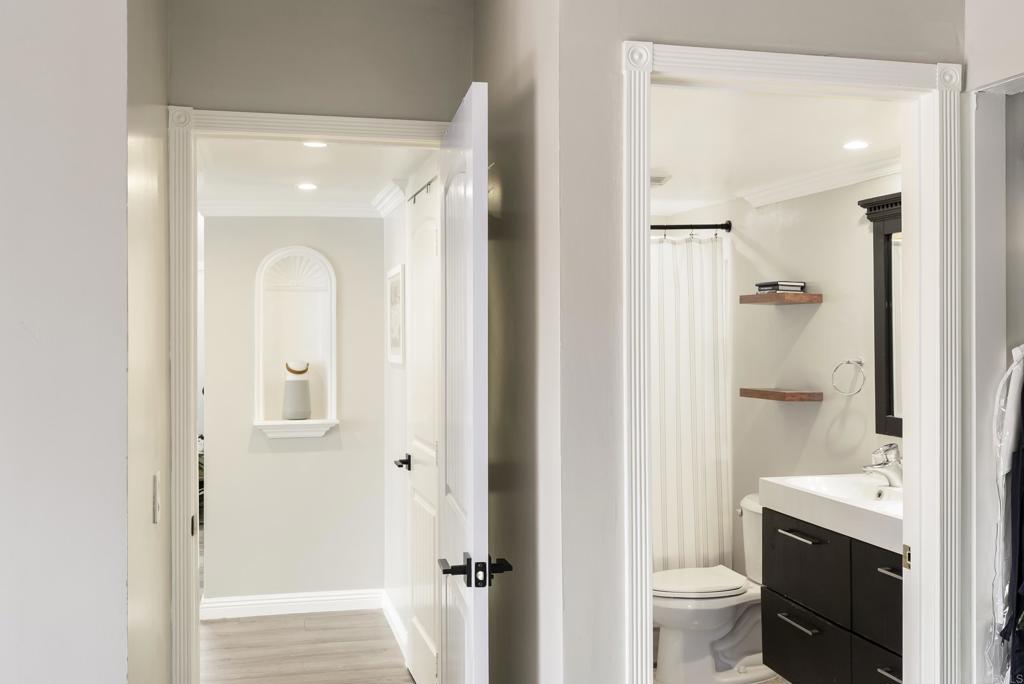 2920 Briarwood Road, Unit G11 Bonita, CA 91902 - Photo 17 of 23 a bathroom with a granite countertop sink mirror vanity and toilet