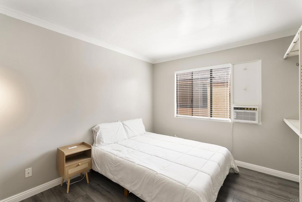 2920 Briarwood Road, Unit G11 Bonita, CA 91902 - Photo 18 of 23 a bedroom with a bed and a window