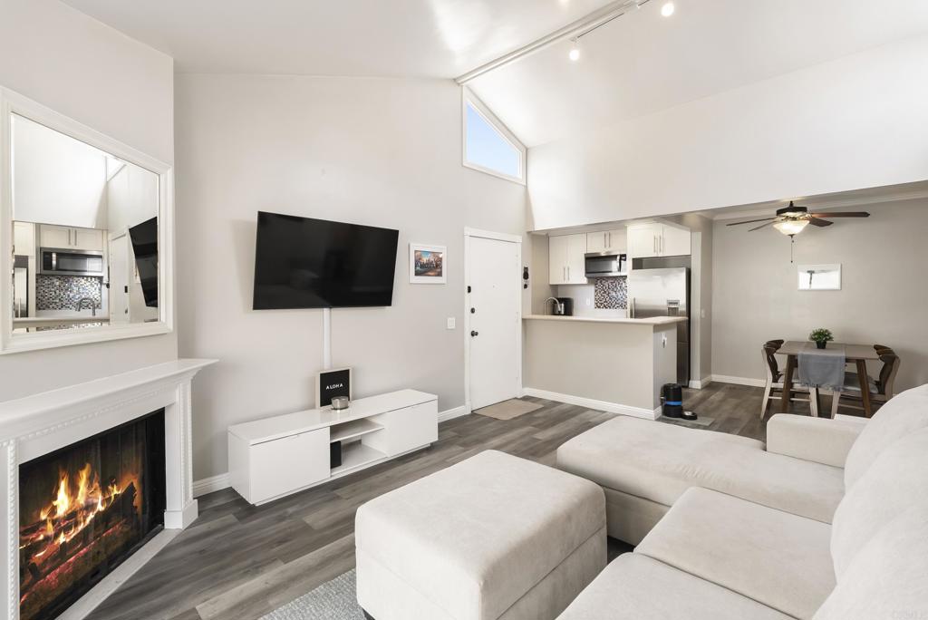 2920 Briarwood Road, Unit G11 Bonita, CA 91902 - Photo 2 of 23 a living room with furniture and a flat screen tv