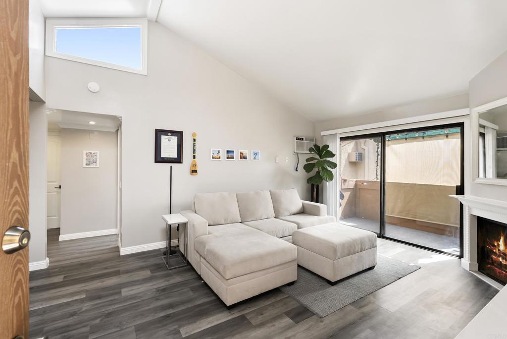 2920 Briarwood Road, Unit G11 Bonita, CA 91902 - Photo 5 of 23 a living room with furniture large window and wooden floor