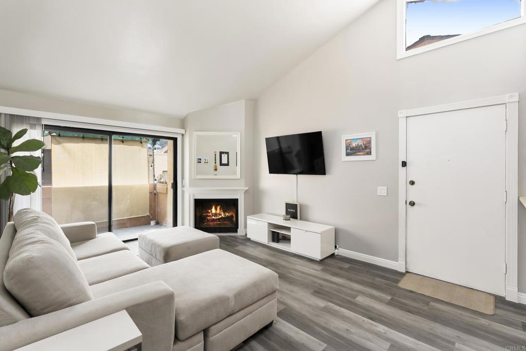 2920 Briarwood Road, Unit G11 Bonita, CA 91902 - Photo 6 of 23 a living room with furniture a fireplace and a flat screen tv