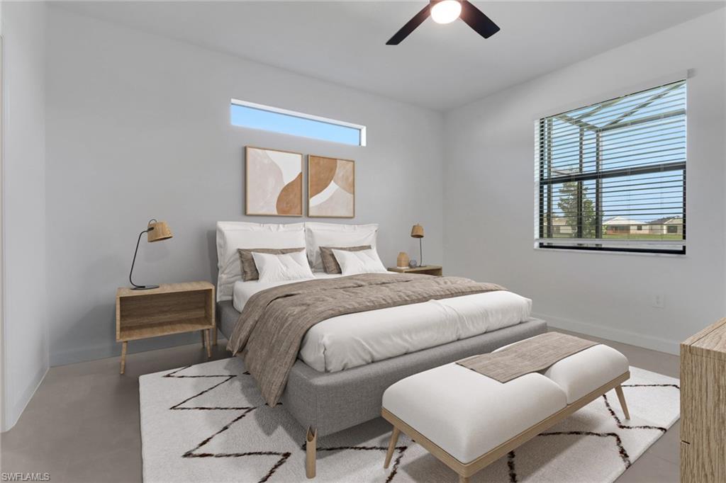 19513 Hinkley Drive Estero, FL 33928 - Photo 12 of 38 a bedroom with a bed and a chandelier