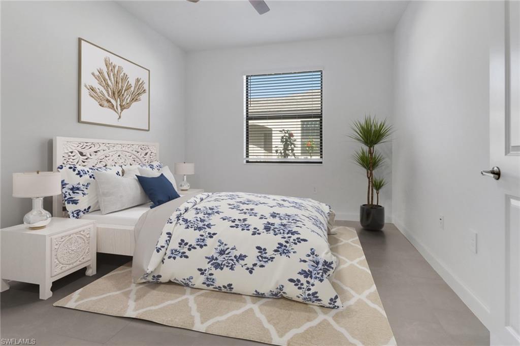 19513 Hinkley Drive Estero, FL 33928 - Photo 17 of 38 a bedroom with a bed and a painting on the wall