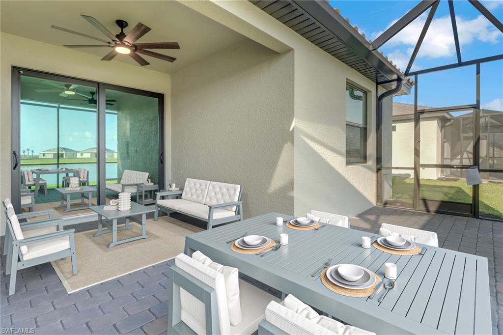 19513 Hinkley Drive Estero, FL 33928 - Photo 22 of 38 a living room with furniture and a large window