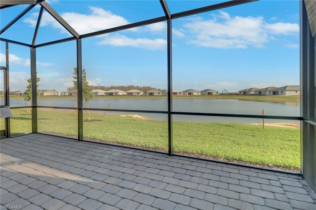19513 Hinkley Drive Estero, FL 33928 - Photo 24 of 38 a view of a balcony with a floor to ceiling window next to a yard