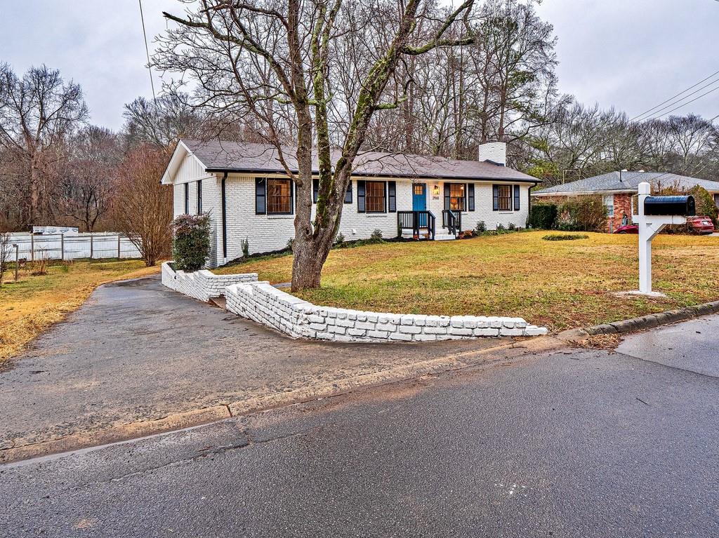2965 Nursery Road Southeast Smyrna, GA 30082 - Photo 1 of 1 a front view of a house with swimming pool