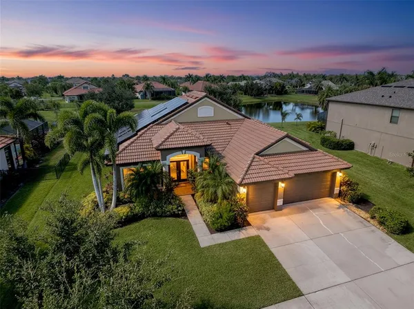 a aerial view of a house with a yard