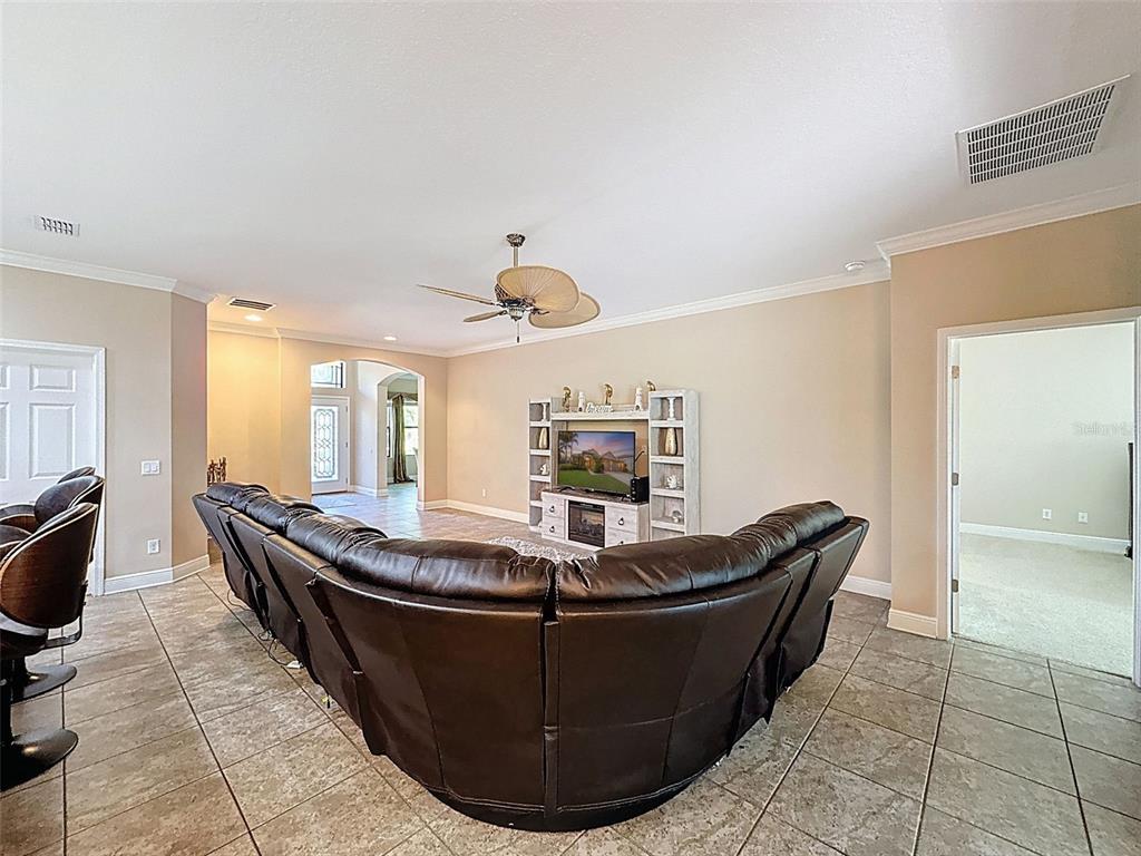 335 Cockle Shell Loop Apollo Beach, FL 33572 - Photo 13 of 90 a living room with furniture and flat screen tv