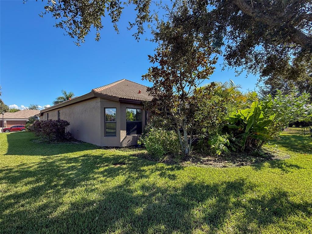 335 Cockle Shell Loop Apollo Beach, FL 33572 - Photo 50 of 90 a view of a house with a yard