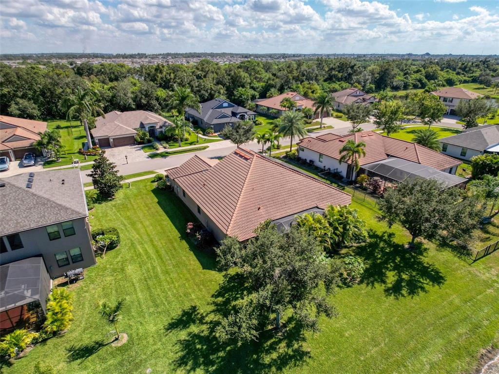 335 Cockle Shell Loop Apollo Beach, FL 33572 - Photo 56 of 90 an aerial view of residential houses with outdoor space