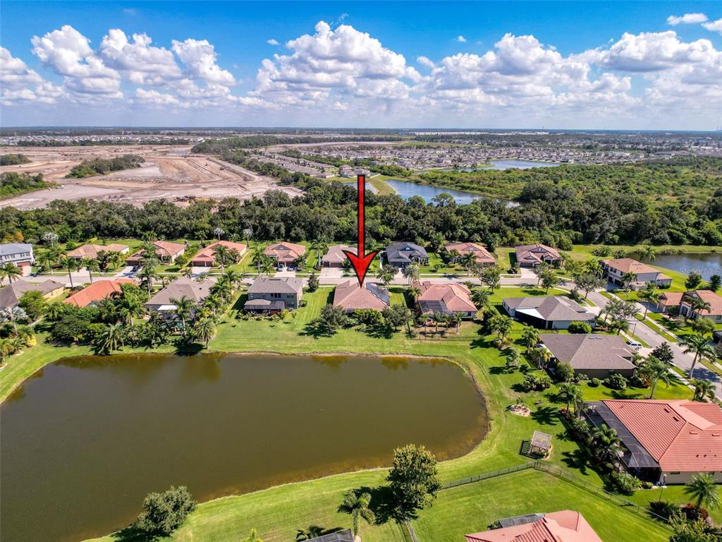 335 Cockle Shell Loop Apollo Beach, FL 33572 - Photo 63 of 90 an aerial view of a city with lots of residential buildings lake and ocean view