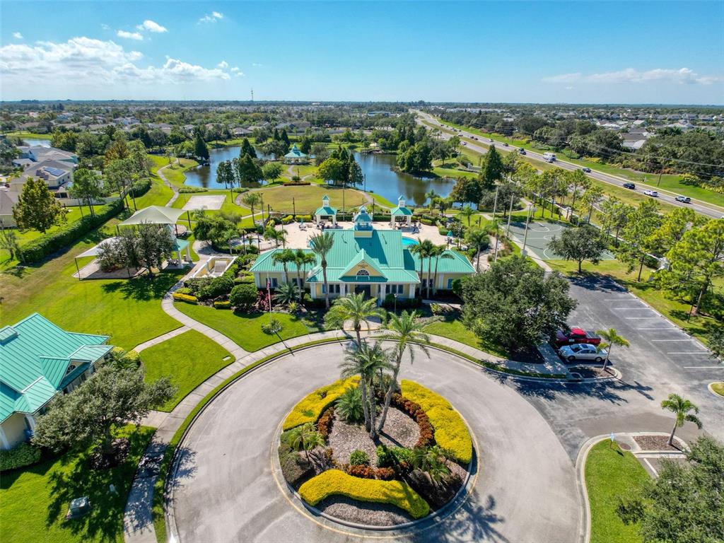 335 Cockle Shell Loop Apollo Beach, FL 33572 - Photo 69 of 90 an aerial view of a swimming pool with a yard