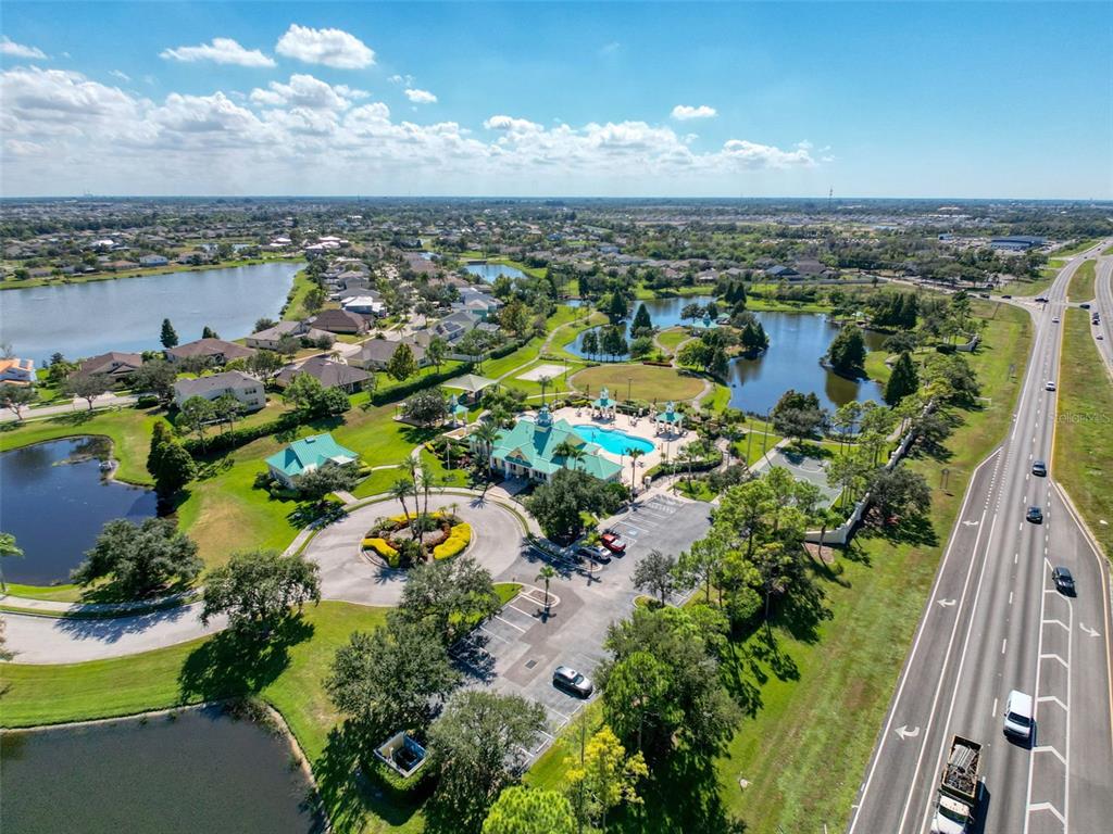 335 Cockle Shell Loop Apollo Beach, FL 33572 - Photo 71 of 90 an aerial view of a city with lots of residential buildings lake and ocean view