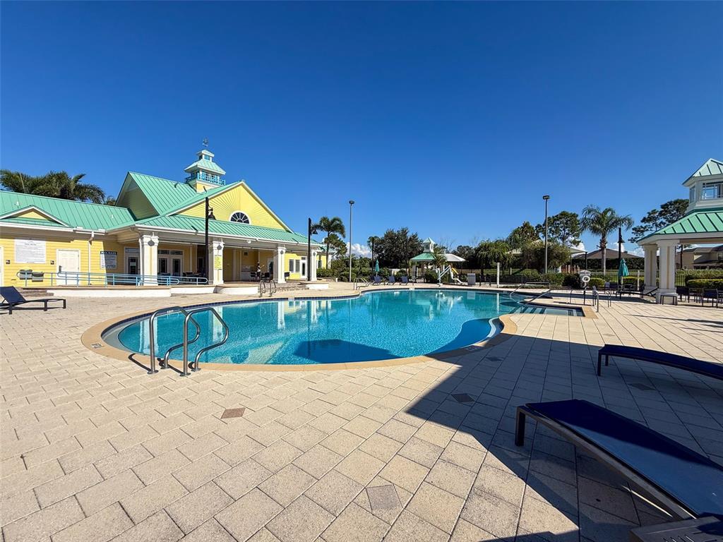 335 Cockle Shell Loop Apollo Beach, FL 33572 - Photo 83 of 90 a view of a house with swimming pool and sitting area