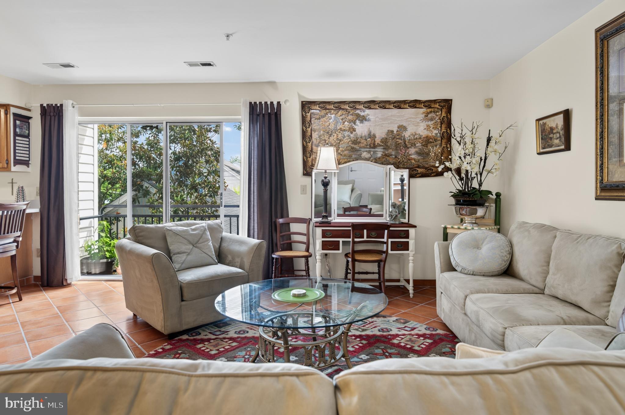 936 Bay Ridge Avenue, Unit 201 Annapolis, MD 21403 - Photo 10 of 40 a living room with furniture and a large window