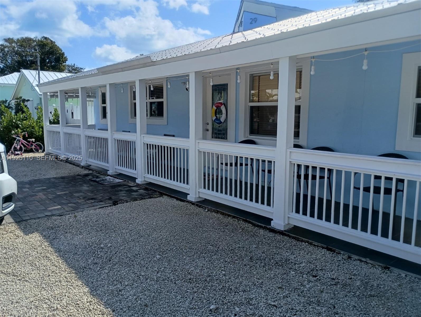 a view of a house with wooden fence