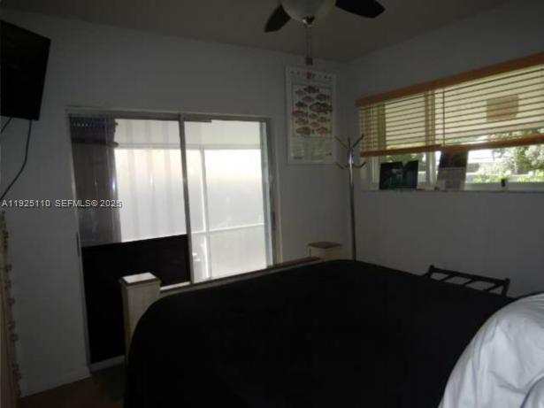 29 Bonefish Avenue Key Largo, FL 33037 - Photo 12 of 31 a bedroom with a bed and a window