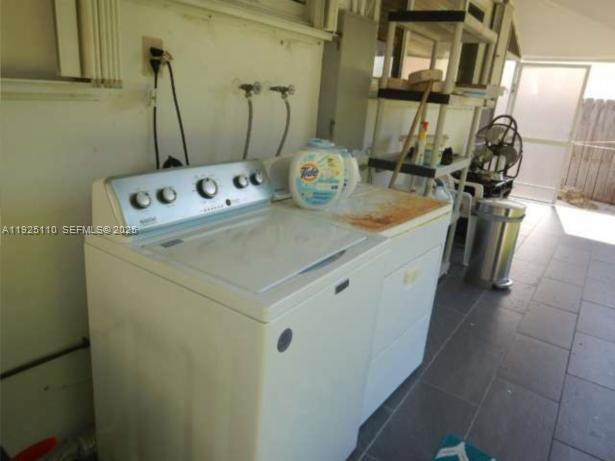 29 Bonefish Avenue Key Largo, FL 33037 - Photo 14 of 31 a utility room with dryer and washer