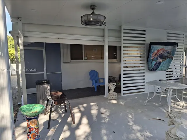 a bed room with a bed and a flat screen tv