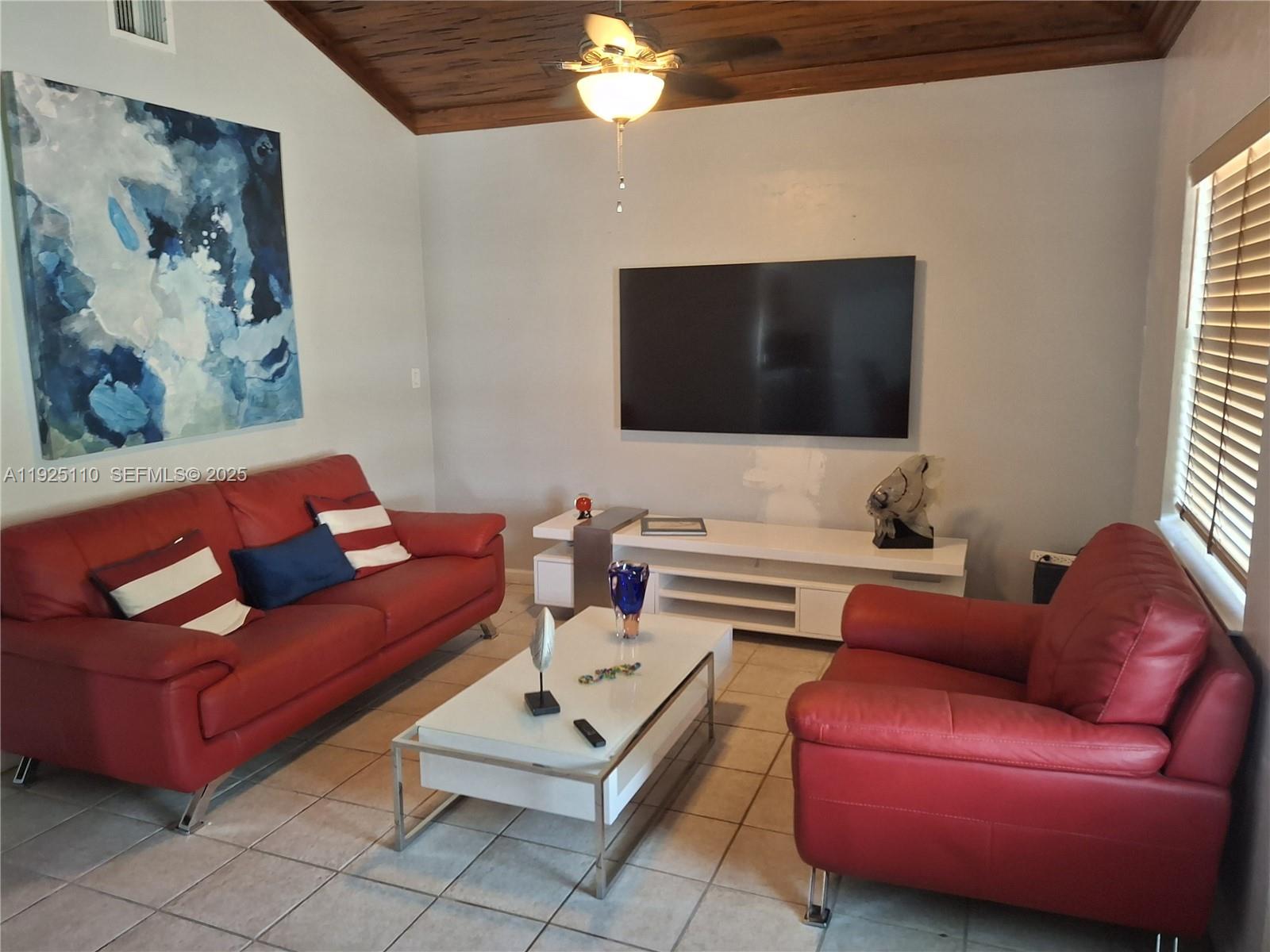 29 Bonefish Avenue Key Largo, FL 33037 - Photo 31 of 31 a living room with furniture and a flat screen tv