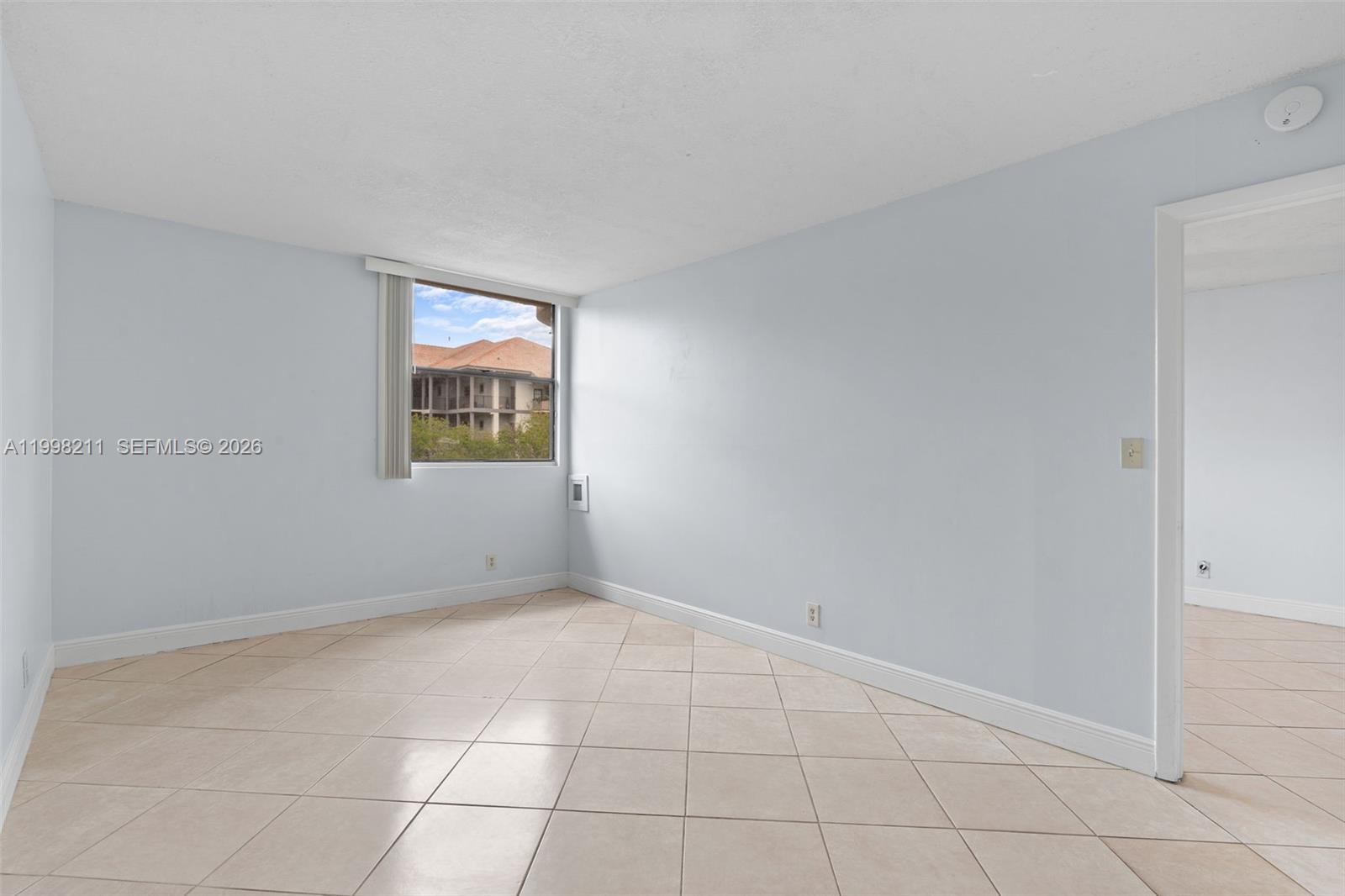 2771 Riverside Drive, Unit 316A Coral Springs, FL 33065 - Photo 11 of 20 an empty room with windows