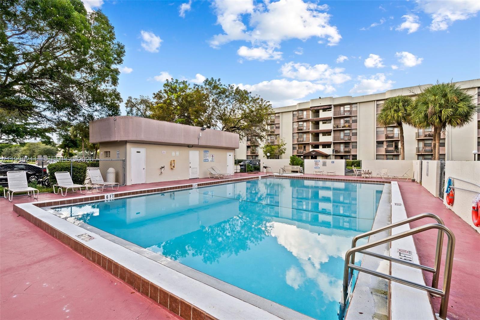2771 Riverside Drive, Unit 316A Coral Springs, FL 33065 - Photo 20 of 20 swimming pool view with a outdoor space