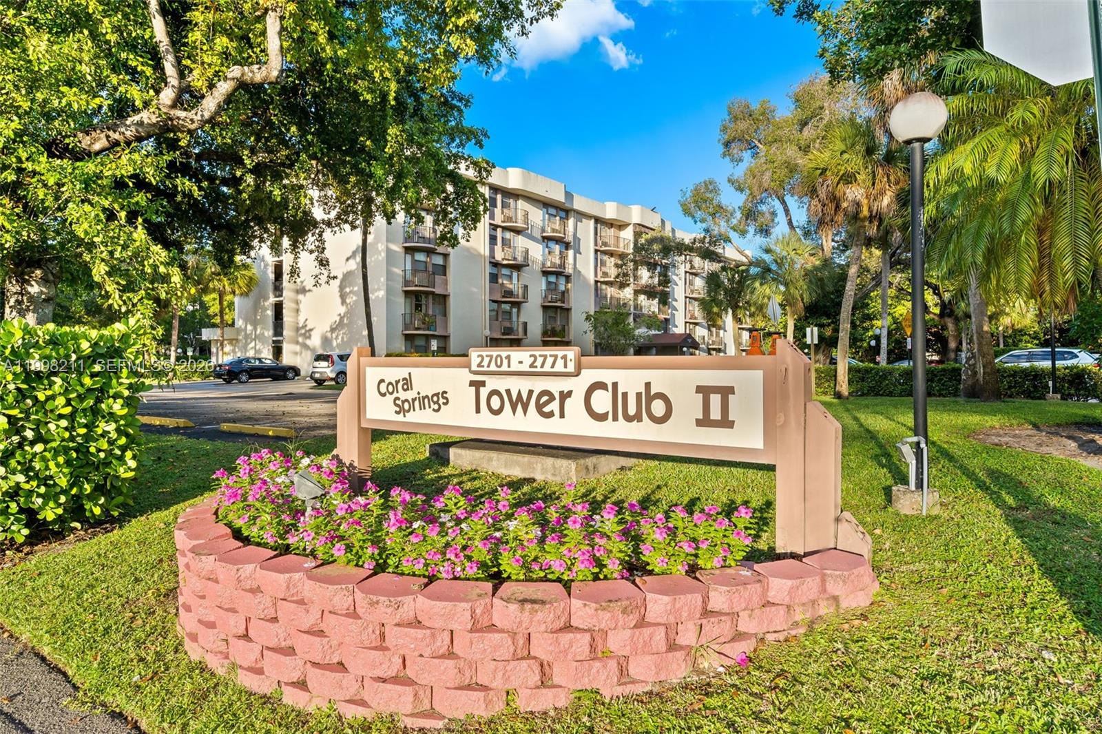 2771 Riverside Drive, Unit 316A Coral Springs, FL 33065 - Photo 2 of 20 a sign on the side of the road