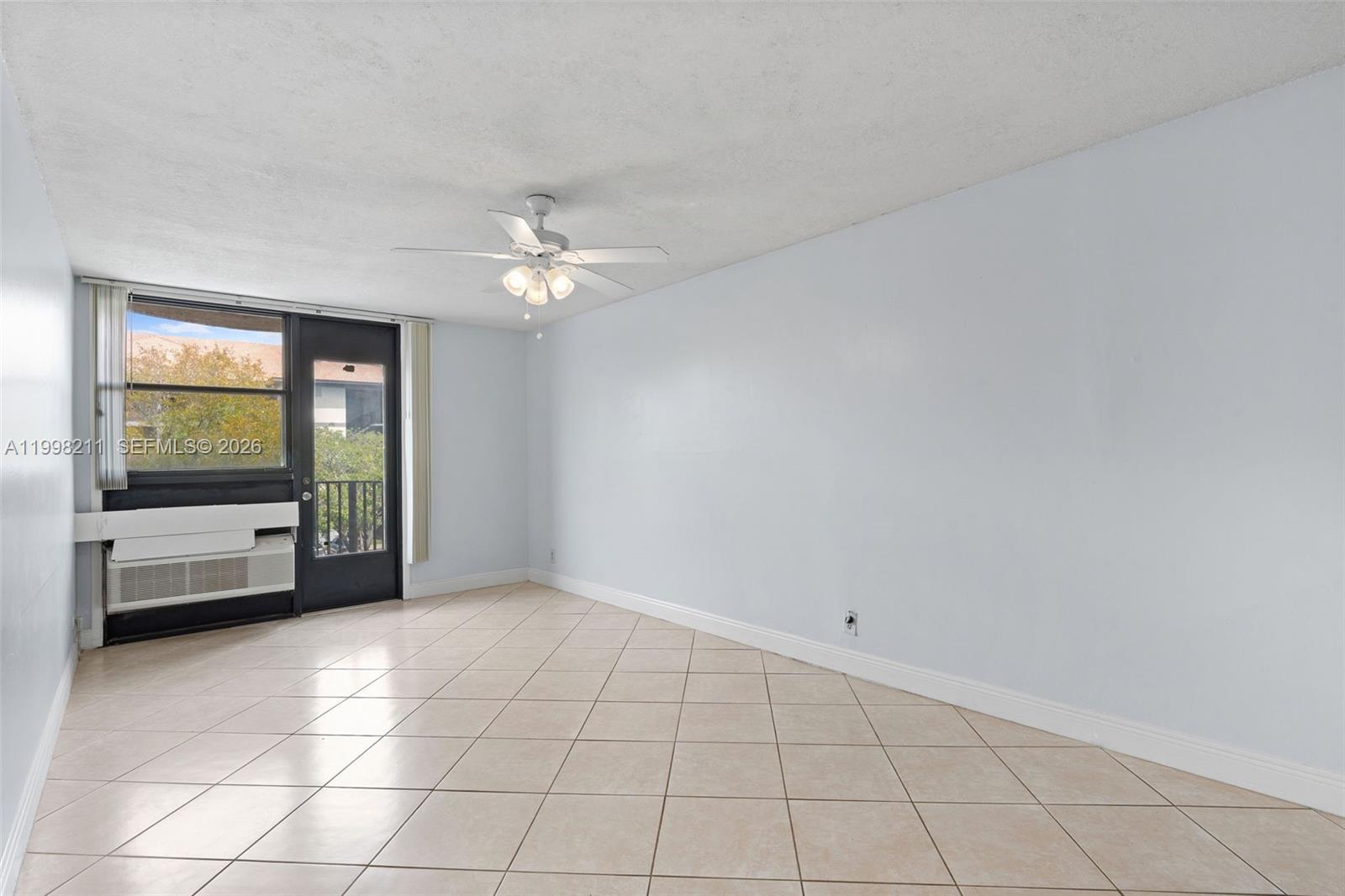 2771 Riverside Drive, Unit 316A Coral Springs, FL 33065 - Photo 4 of 20 a view of an empty room with a window