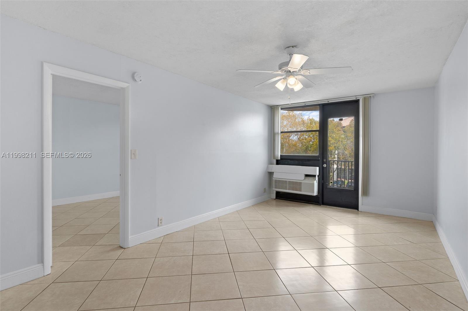 2771 Riverside Drive, Unit 316A Coral Springs, FL 33065 - Photo 8 of 20 a view of an empty room with a kitchen