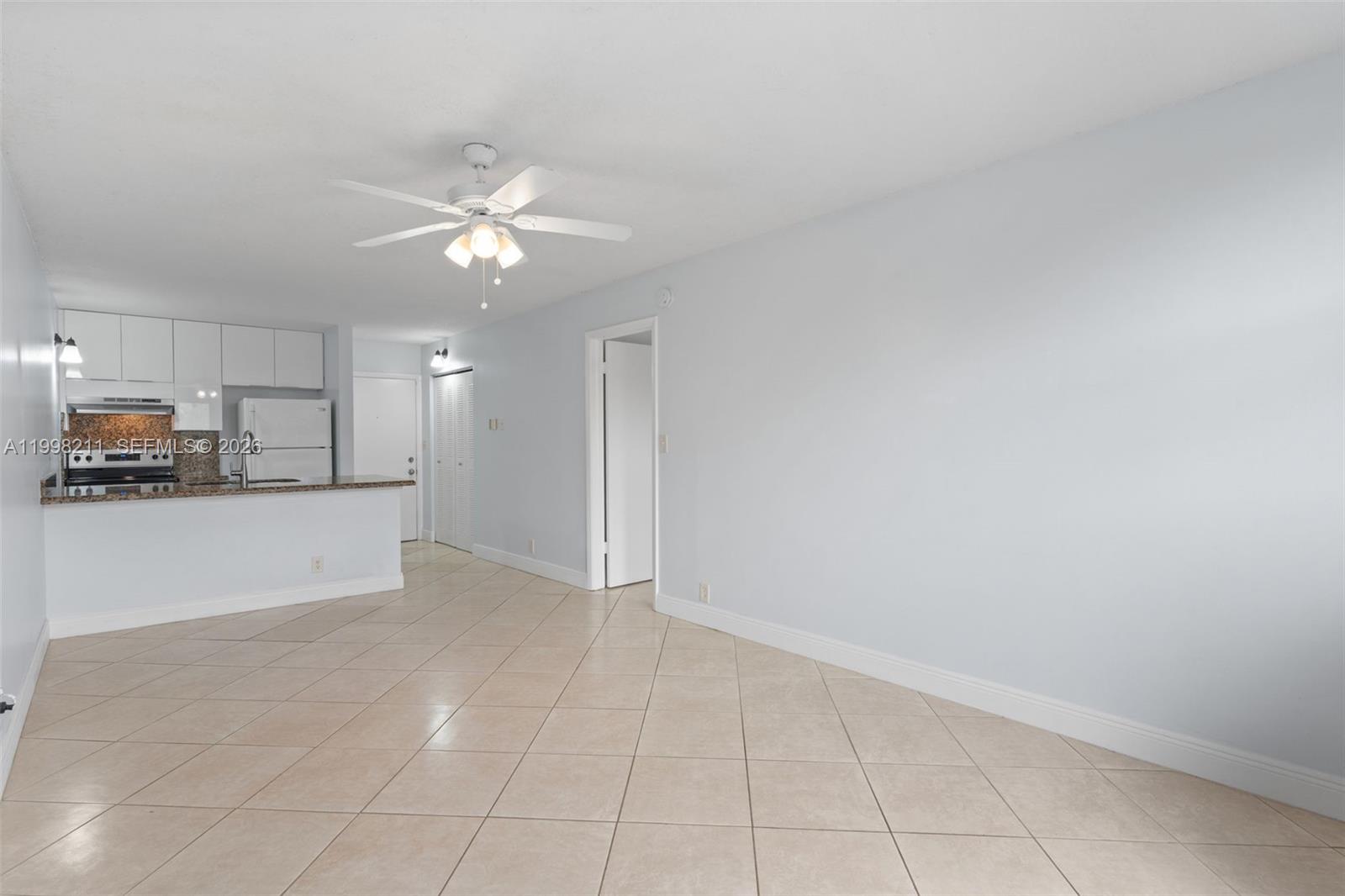 2771 Riverside Drive, Unit 316A Coral Springs, FL 33065 - Photo 9 of 20 a view of an empty room and kitchen view