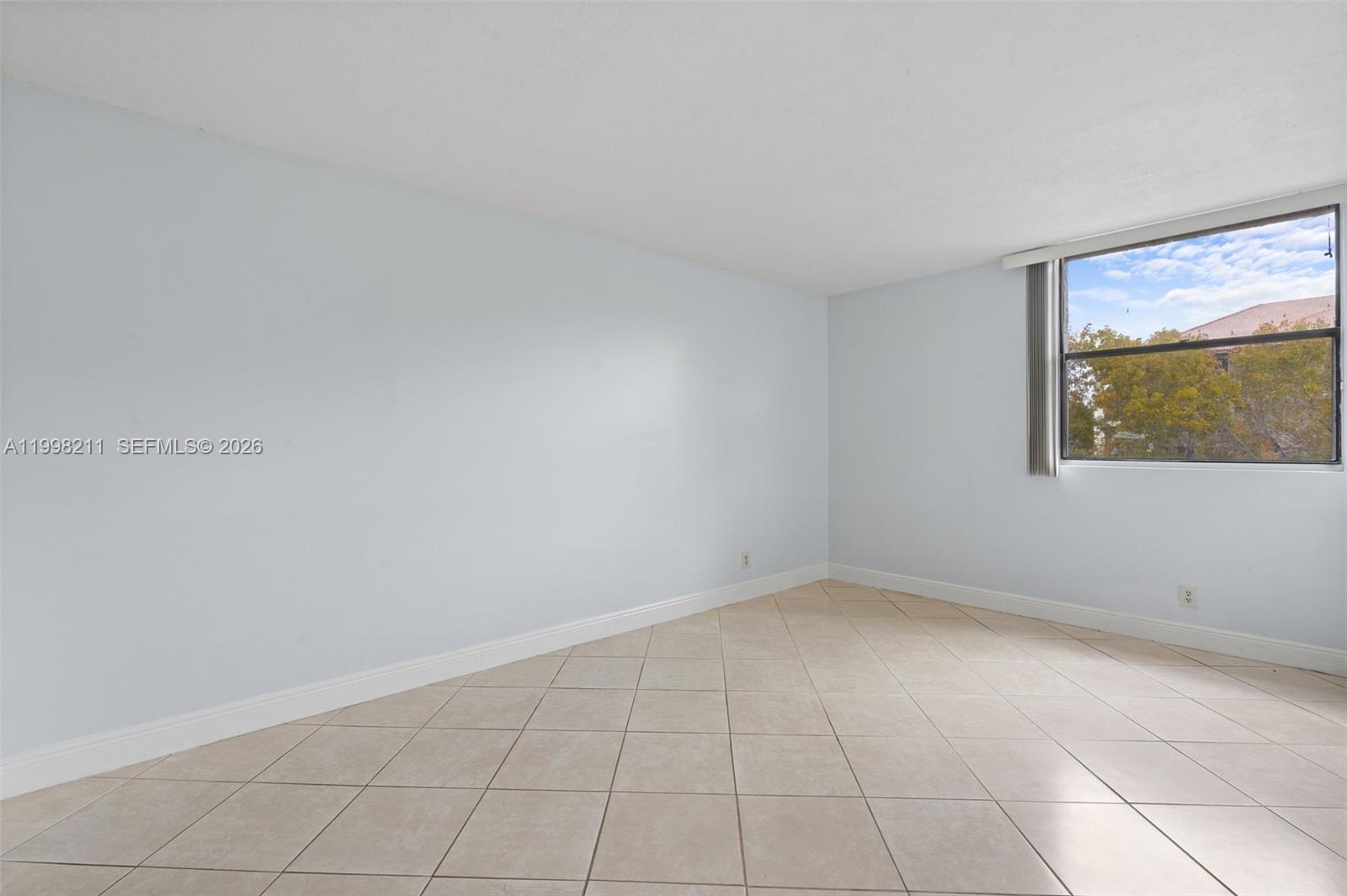 2771 Riverside Drive, Unit 316A Coral Springs, FL 33065 - Photo 10 of 20 an empty room with a window