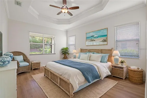 a spacious bedroom with a large bed and a window