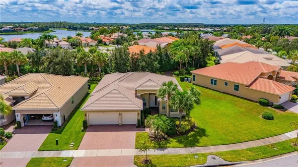 an aerial view of a house with garden space and street view