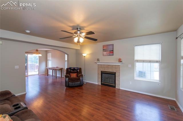 756 Ridgebury Place Fountain, CO 80817 - Photo 4 of 30 Living Room with Gas Fireplace