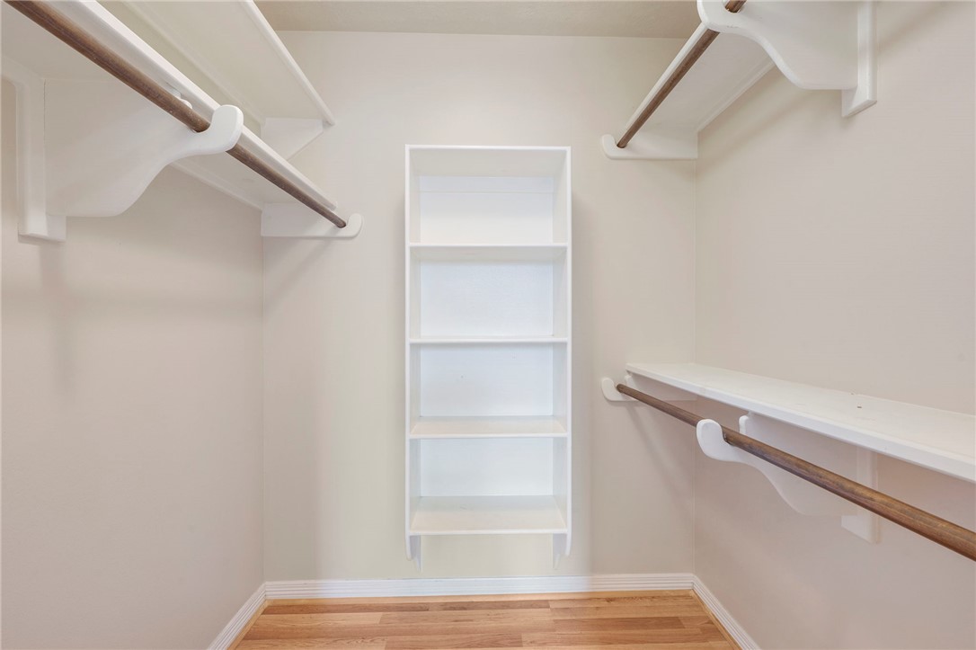 713 Willow Loop College Station, TX 77845 - Photo 19 of 39 a view of walk in closet with empty racks