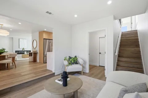 a living room with furniture and a table